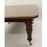 Large Victorian mahogany rectangular wind-out extending dining table, the moulded top above a