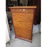 19th Century camphor wood Wellington chest, the moulded top above eight drawers with brass handles