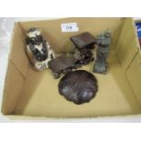 Four miscellaneous oriental items comprising:- small black and white glazed figure, small bronze