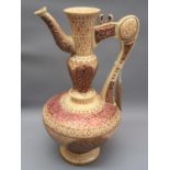 Zsolnay Pecs ewer form jug vase with shaped handle and spout, decorated in magenta and pink on a