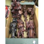 Collection of mainly oriental carved wooden figures of sages and other figures