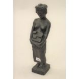 20th Century brown patinated bronze figure of a lady carrying bricks, 17.5ins high