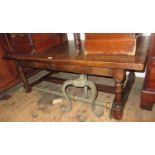 Reproduction oak occasional table with two small frieze drawers on turned supports with stretcher,