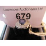 Platinum oval sapphire and diamond cluster ring
