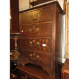 Late 19th / early 20th Century oak narrow chest of four drawers with brass handles and