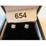 Pair of white gold diamond solitaire stud earrings About 0.3ct total diamond weight. Slight flaws