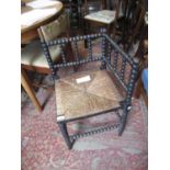Late Victorian ebonised and bobbin turned corner chair with a rush seat, together with a late 19th