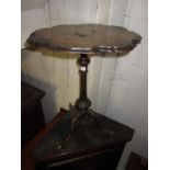 19th Century walnut inlaid shaped top pedestal table having carved reeded pedestal and cabriole