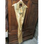 Gold satin long evening dress with beaded collar and belt