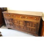 18th Century oak dresser base, the plank top above three drawers with brass knob handles and a