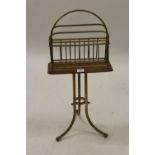Late 19th / early 20th Century oak and brass magazine rack with swivel top
