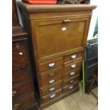 Early to mid 20th Century oak office cabinet, the moulded top above a fall front enclosing a