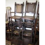 Set of six late 19th / early 20th Century oak dining chairs with cane backs and seats in Carolean