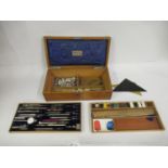 Late 19th / early 20th Century oak and brass bound case containing a part set of drawing instruments