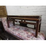 Early 20th Century Chinese elm bench seat with a pierced frieze raised on square moulded supports