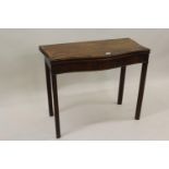 George III mahogany crossbanded and line inlaid serpentine fronted card table with a fold-over