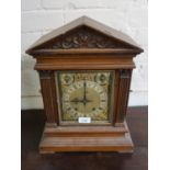 Late 19th Century Continental walnut mantel clock, the gilded and silvered dial with Roman and