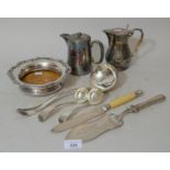 Continental white metal serving slice together with a 19th Century plated bottle stand, bread knife,