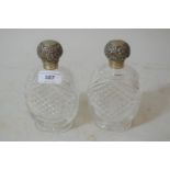 Pair of silver mounted oval cross cut glass perfume bottles