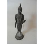 Thai dark patinated bronze figure of standing Buddha, 25.5ins high