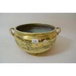 19th Century Chinese polished bronze two handled shallow bowl decorated in relief with landscapes (