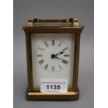 20th Century brass cased carriage clock, the enamel dial with Roman numerals and single train