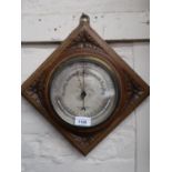 Carved oak aneroid barometer / thermometer by T. Armstrong, Manchester