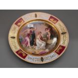 19th Century Vienna circular wall plate, painted with classical figures in a landscape, within a