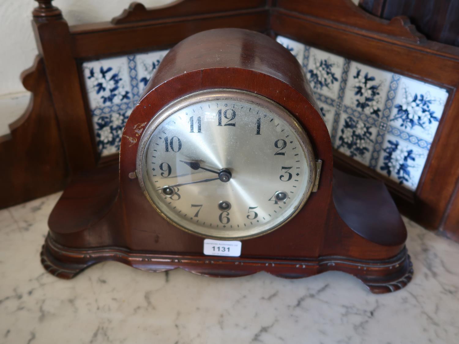 20th Century mahogany dome shaped mantel clock having circular silvered dial with three train