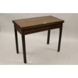 George III mahogany rectangular fold-over card table with a plain frieze and four square cut