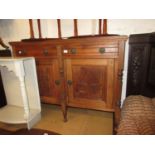 19th century Continental walnut side cabinet with two drawers above two carved panel doors on turned