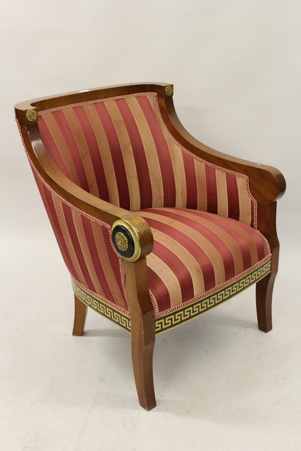 Pair of Continental reproduction mahogany and upholstered gilt metal mounted shaped chairs in