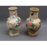 Pair of Japanese Satsuma pottery baluster form vases painted with birds in landscapes (at fault),
