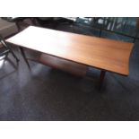 Richard Hornby for Heals, mid 20th Century teak coffee table, the shaped top above tapering supports