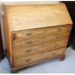 George III mahogany bureau, the fall front enclosing fitted interior above four drawers on bracket