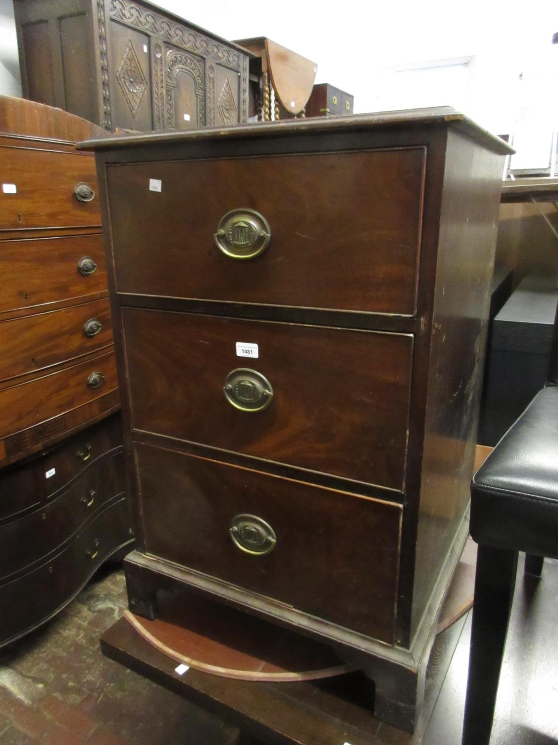 19th Century mahogany three drawer chest with oval brass handles raised on bracket feet ( back