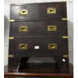 Small mahogany brass mounted straight front chest in military style with two short and two long