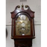 Late 18th Century mahogany longcase clock with a broken arch hood above an arched panel door, with