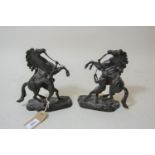 Pair of small 19th Century dark patinated bronze Marli horse groups, signed to the naturalistic