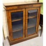 Late 19th Century walnut and floral inlaid pier cabinet, having two glazed doors enclosing two