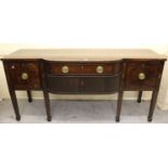 George III mahogany semi bow front sideboard, the crossbanded top above drawers and tambour doors on