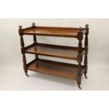 William IV mahogany three tier buffet with turned reeded supports and brass and ceramic casters,