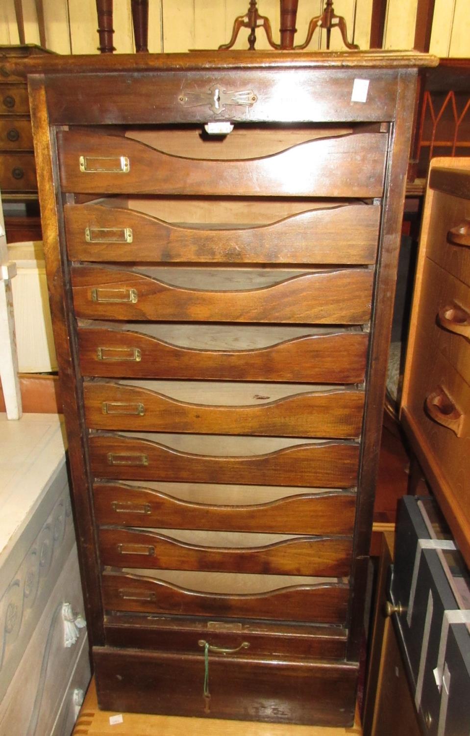 Early 20th Century stained beechwood index cabinet with a tambour front enclosing sliding trays,