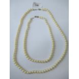 Single row uniform cultured pearl necklace, 23ins long approximately together with another