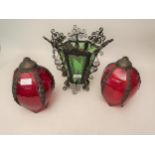 Black painted iron scroll work ceiling shade / lantern with green glass panels and a pair of