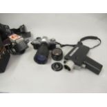 Canon AV-1 SLR camera with Ozeck II camera lens, a Canon FD 50mm lens and accessories, together with