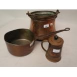 Middle Eastern circular copper cooking pan with an iron swing handle, copper saucepan and a copper