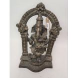 20th Century dark patinated bronze figure of Ganesh beneath an archway on a shaped plinth base,