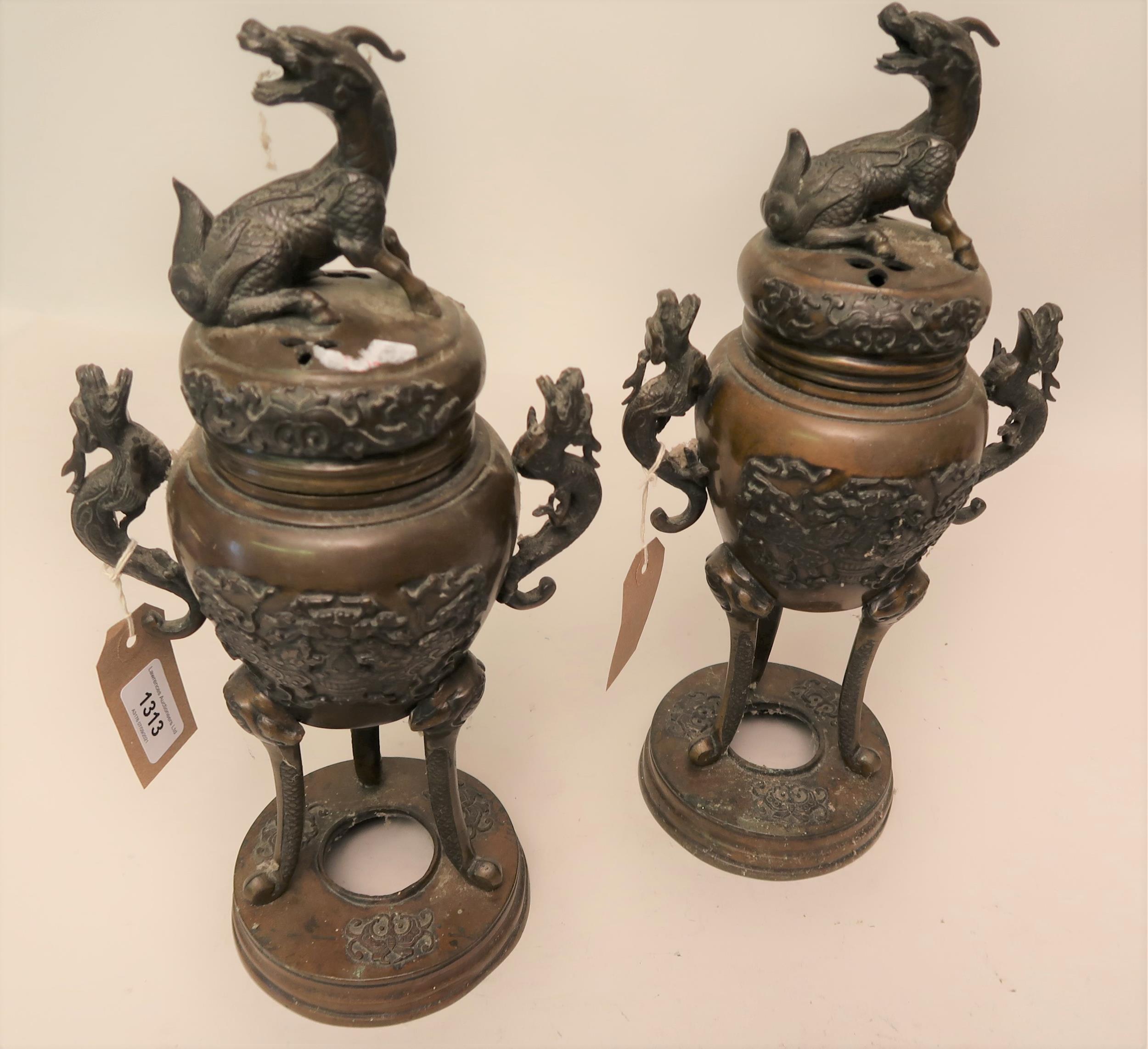 Pair of late 19th Century Japanese brown patinated bronze two handled censers with covers, 15ins