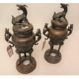 Pair of late 19th Century Japanese brown patinated bronze two handled censers with covers, 15ins